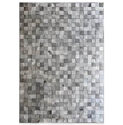 A rectangular surface of high end designer rugs with small, textured gray tiles in a grid.