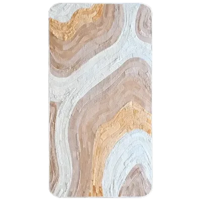 Luxury designer rug with wavy beige, tan, and white patterns on a high-end rectangular surface.