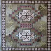Winterlude Hide 26020 luxury designer rug with geometric motifs, leaf accents, and earth tones.