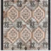Luxury designer rug with textured background and diamond star patterns in beige, gray, and black.