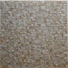 Surrender Hide 15561 is a luxury designer rug with a mosaic of handmade hide tiles in brown, beige, and gray.