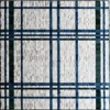 Luxury high-end designer rug with a white base and intersecting blue and green plaid lines.