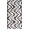 Flow Hide 29576 luxury designer rug with textured surface and metallic abstract waves.