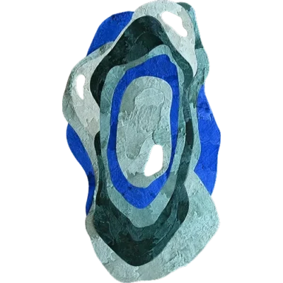 Luxury designer rug with abstract blue, green, and white concentric shapes and textured cut-out details.