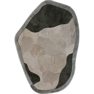 Luxury designer rug with an abstract shape, handmade hide patchwork in grey tones.