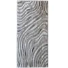Rectangular luxury designer rug with silver waves on a textured metallic grey surface.