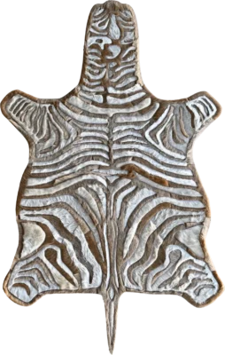 Luxury handmade hide rug featuring tanned zebra skin with bold white and brown stripes.