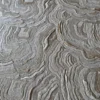 Aubusson Hide 16290 is a luxury designer rug with wavy, textured, topographic patterns in neutral tones.