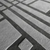 Luxury designer rug with a raised geometric gray pattern, crafted as a high-end wool rug.