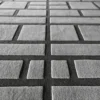 Close-up of Tower Wool 15486 luxury designer rug, showing textured gray wool tiles from a low angle.