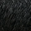 Close-up of luxury designer rug Custom Hide 15473, featuring textured black hide and bold, raised diagonal ridges.