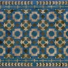 Luxury custom designer rug with geometric star mosaic in blue, green, tan, and beige.