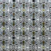 Luxury designer rug with geometric diamond patterns in black, white, gray, and olive green.
