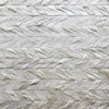 Close-up of Lance Hide 14723, a luxury designer rug with herringbone pattern and textured handmade hide surface.