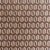 Close-up of a luxury custom rug with a hexagonal embossed pattern in rich brown wool.
