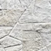 Luxury designer rug featuring a geometric patchwork of white and cream faux fur hide.