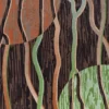 This luxury designer wool rug features wavy lines and circles in earth tones on a dark base.