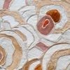 Luxury designer rug from the Bloom Hide 16038 collection with abstract overlapping beige, white, and brown shapes on a textured high-end surface.