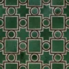 Ignition Hide 16101 luxury designer rug with green geometric shapes and brown outlines on a high-end tiled pattern.