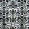 Luxury designer rug featuring geometric diamonds in black, white, blue, and olive green.