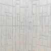 Luxury designer rug in beige with a geometric raised pattern, evoking high-end silk and wool craftsmanship.