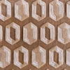 Close-up of luxury custom designer rug: textured brown wool with geometric hexagon pattern and white outline accents.