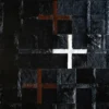 Luxury designer rug with textured black surface, brown and white crosses, handmade hide style.