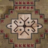 A luxury designer rug with a geometric, symmetrical pattern in rich hues on textured hide.