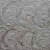 Close-up of wavy, layered wood textures inspiring luxury designer rugs and high end handmade hide rugs.