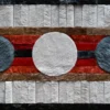 The Atlas Hide 15902 is a high end designer rug with textured strips and bold circles.