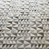 Close-up of Esperanza Hide 27929, a luxury designer rug with geometric beige and gray pattern.