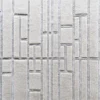 Close-up of luxury designer rug Tower Silk Wool 26836, textured beige wool with raised geometric rectangles.