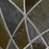 Close-up of luxury designer rug, Silhouette Hide 27680, with metallic geometric patterns on textured handmade hide surface.