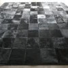 Promenade Hide 30151 handmade designer rug with bold black and dark gray luxury checkerboard pattern.
