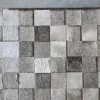 Close-up of 3 Lock Box Hide 15460 luxury designer rug, handmade from grey and off-white hide squares.