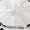 Luxury custom designer rug featuring circular pattern, hide textures, and bold color accents.