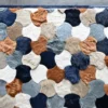 The Leigh Hide 27210 luxury designer rug displays scalloped patterns in brown, tan, blue, and gray with a high-end hide texture.