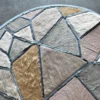 Luxury designer rug with abstract faux fur geometric patches in beige and blue on gray.