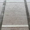 Luxury designer wool and silk rug in beige with bold geometric stripes pattern.