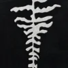 An abstract white tree-like pattern on black, inspired by luxury designer wool rugs.