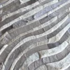 Close-up of luxury designer rug Drift Hide 28893, with hand-stitched fur in abstract gray and white waves.