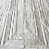 Rectangular pieces of light gray and white Faceta Hide 15388 form a geometric pattern on this luxury handmade designer hide rug.
