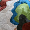 A close-up of a luxury designer hide rug with a vibrant abstract pattern and plush texture.