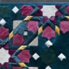 Close-up of Kasbah Hide 15910 luxury designer rug with vibrant geometric patterns and a high-end textured finish.