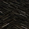 Luxury designer rug with a geometric chevron of dark brown, black, and tan handmade hide strips.