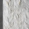 The Lance Hide 14723 is a luxury designer handmade hide rug in chevron gray and white on a dark floor.
