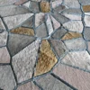 Close-up of Lexar Hide 27375, a luxury designer handmade hide rug in geometric fur patchwork with blue edging.