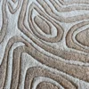 Close-up of luxury designer Urushi handmade silk and wool rug in beige and white with contour-inspired pattern.