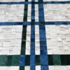 Luxury designer rug in a grid of blue, green, and white fur-like handmade hide squares.