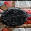 Close-up of Atlas Hide 15902, a luxury designer rug with textured wool, bold shapes, and artisan craftsmanship.